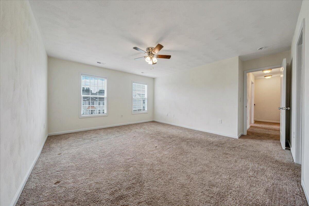 427 Cambridge Ct Road Vinton, VA 24179 - Photo 23 of 46 an empty room with windows and fan
