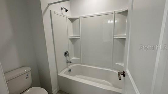 4520 Ranunculus Street Haines City, FL 33844 - Photo 12 of 19 a bathroom with a bathtub and a shower