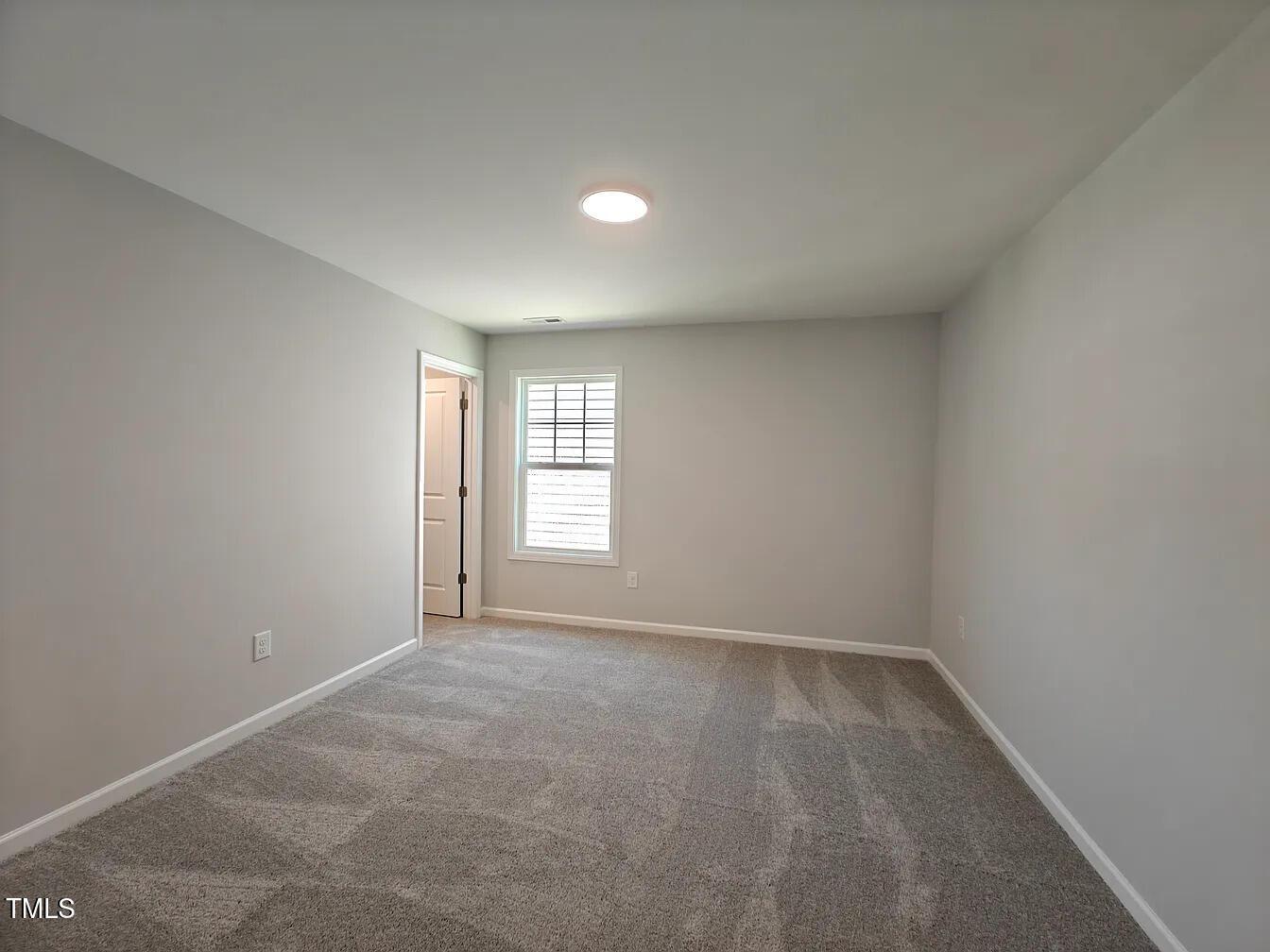 2409 Englemann Drive Apex, NC 27502 - Photo 21 of 25 an empty room with a window