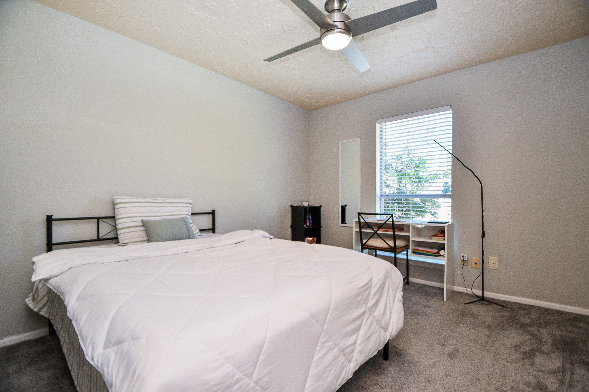 16711 Ribbonridge Drive Sugar Land, TX 77498 - Photo 16 of 24 a bedroom with a bed and a window