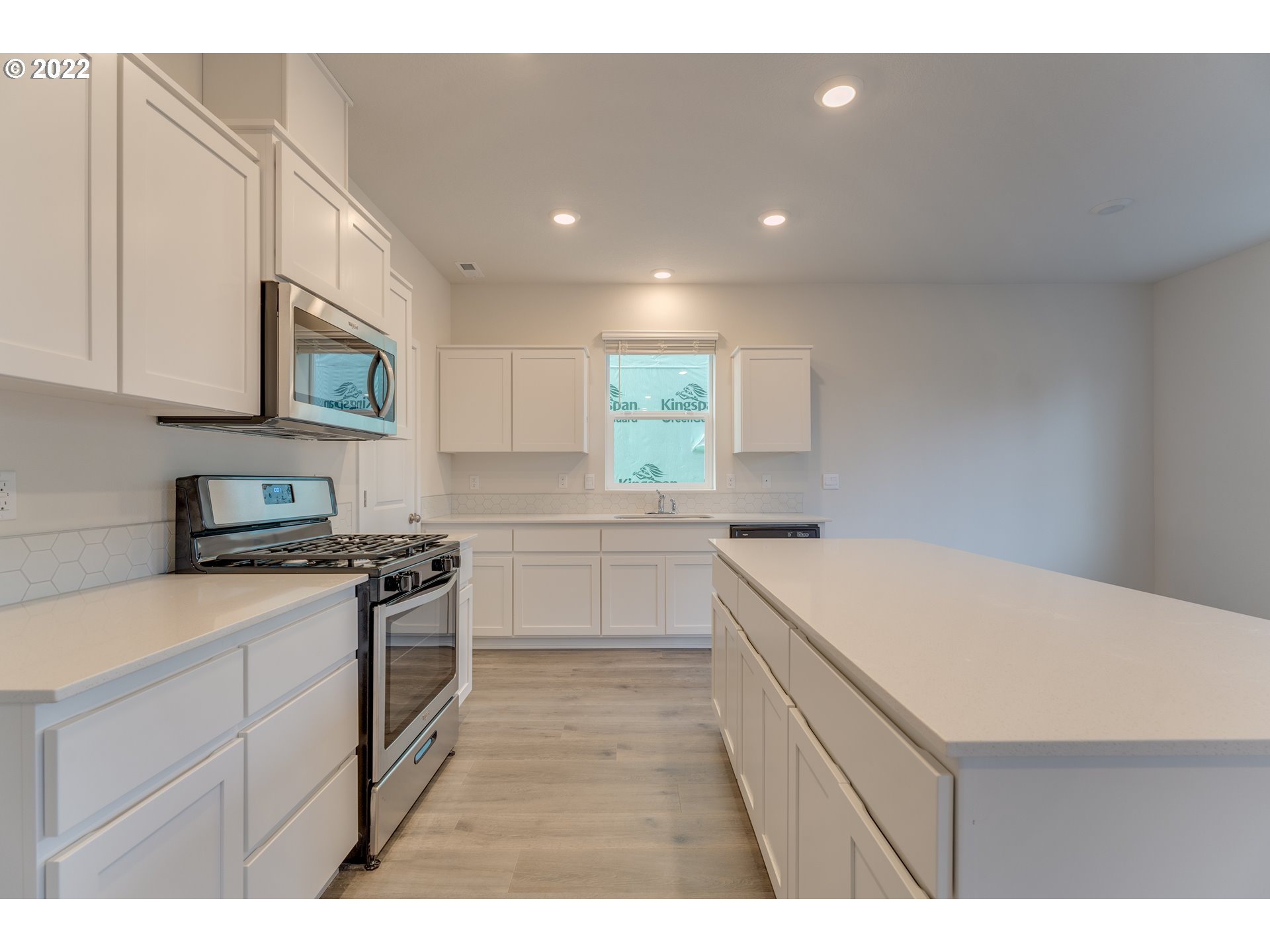 2917 W Street Springfield, OR 97477 - Photo 4 of 26 a kitchen that has a sink a stove and cabinets