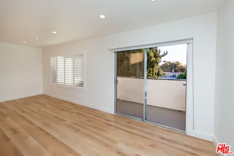a view of a hallway with washer and dryer