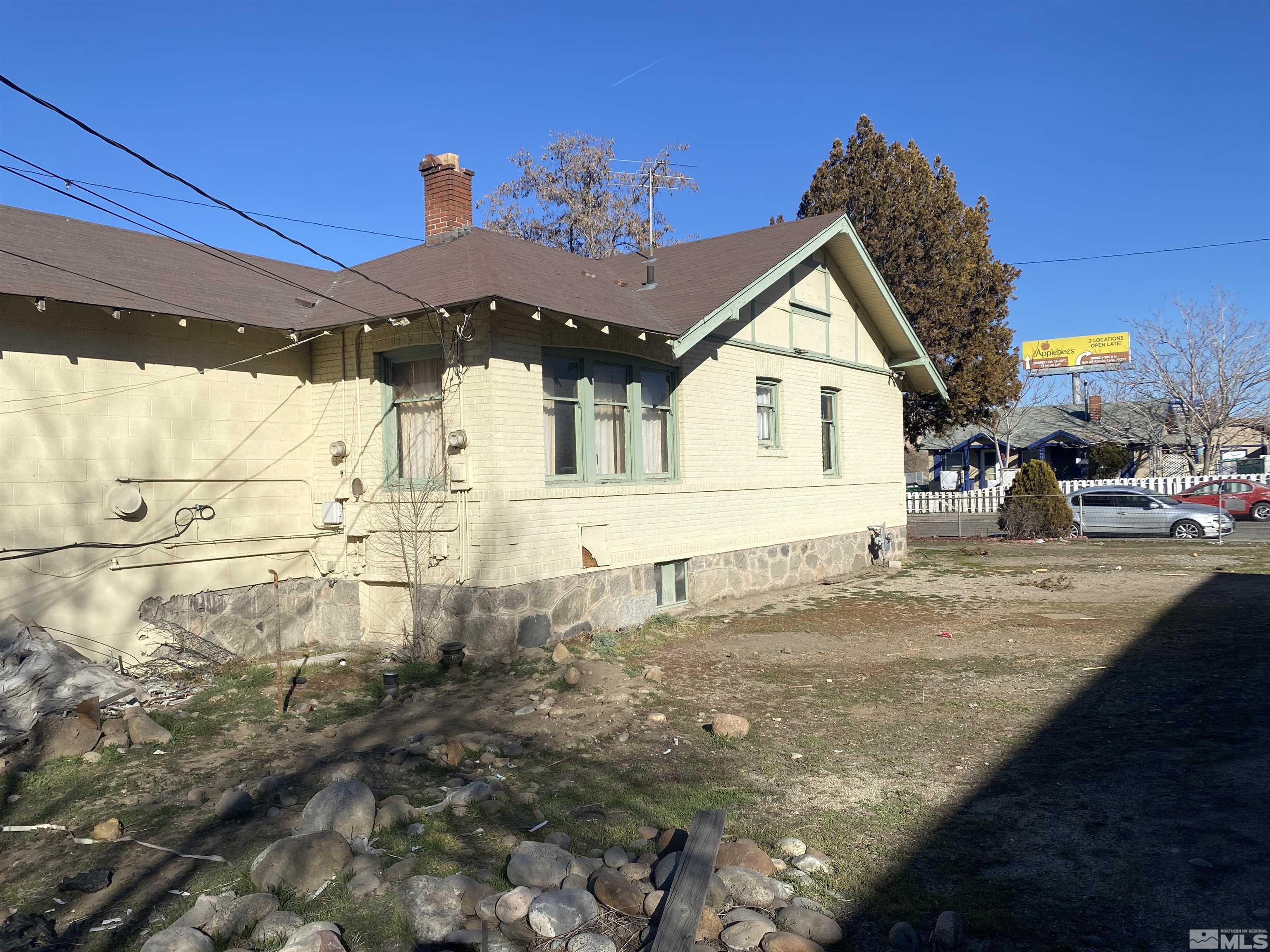 667 Quincy Street Reno, NV 89512 - Photo 3 of 12 a front view of a house with a yard