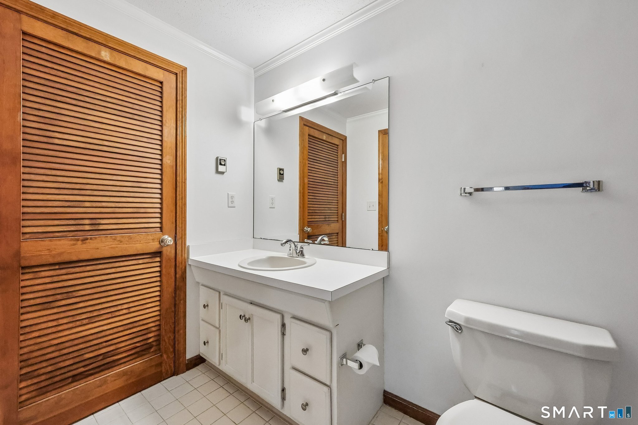 65 Old Route 79, Unit 5 Madison, CT 06443 - Photo 21 of 28 The full bath has a large floor to ceiling closet storage with shelving