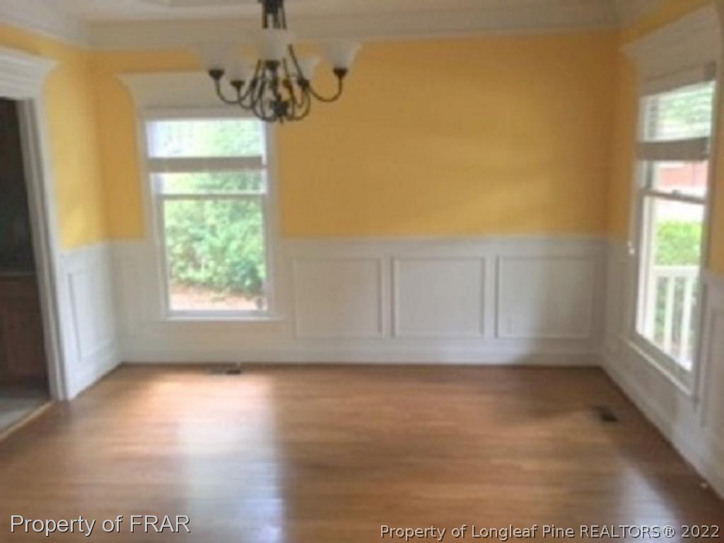 3124 Brechin Road Fayetteville, NC 28303 - Photo 3 of 18 a view of hallway with window and chandelier