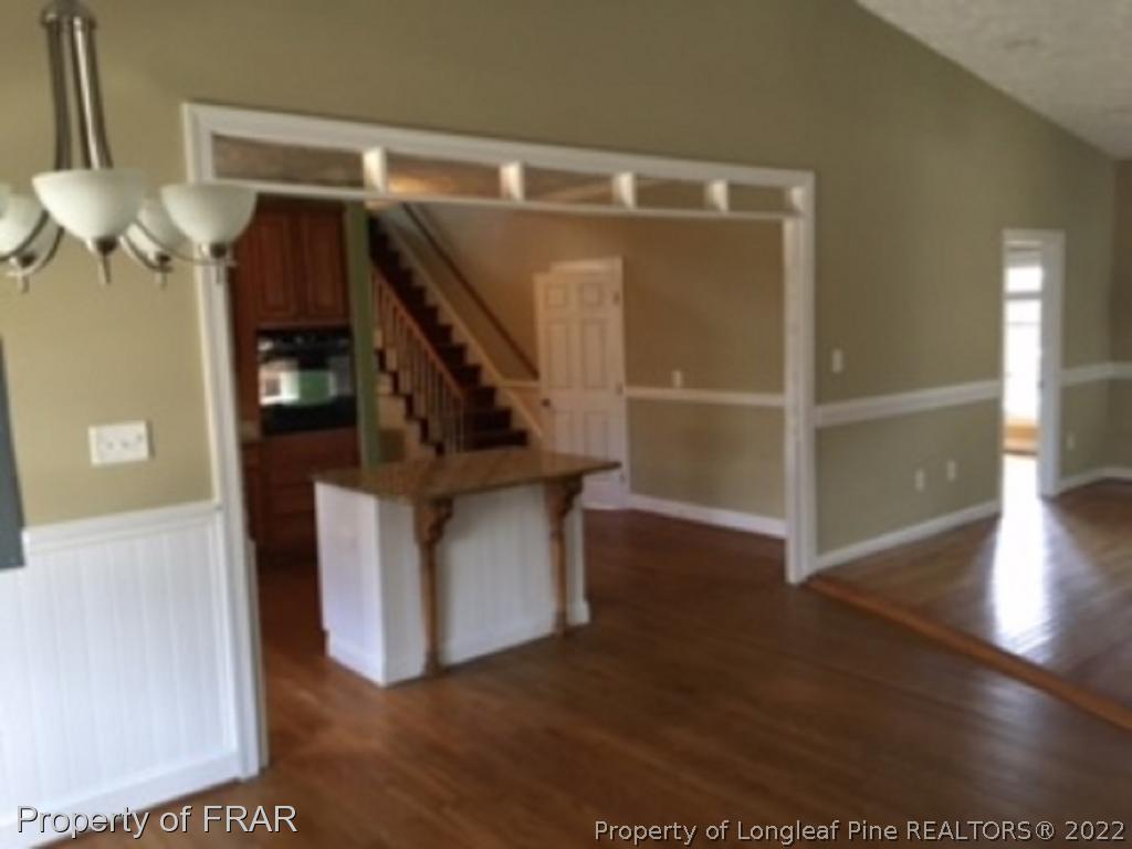 3124 Brechin Road Fayetteville, NC 28303 - Photo 5 of 18 a storage room with wooden floor and windows