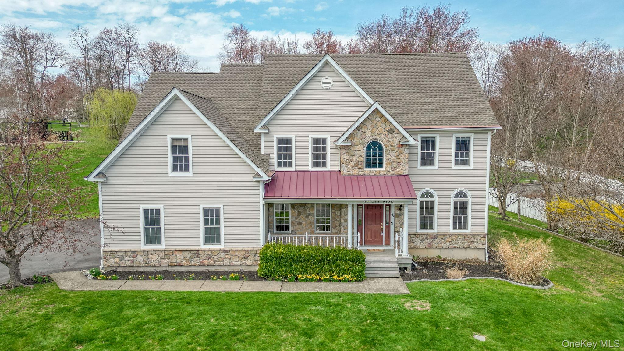 front view of a house with a yard