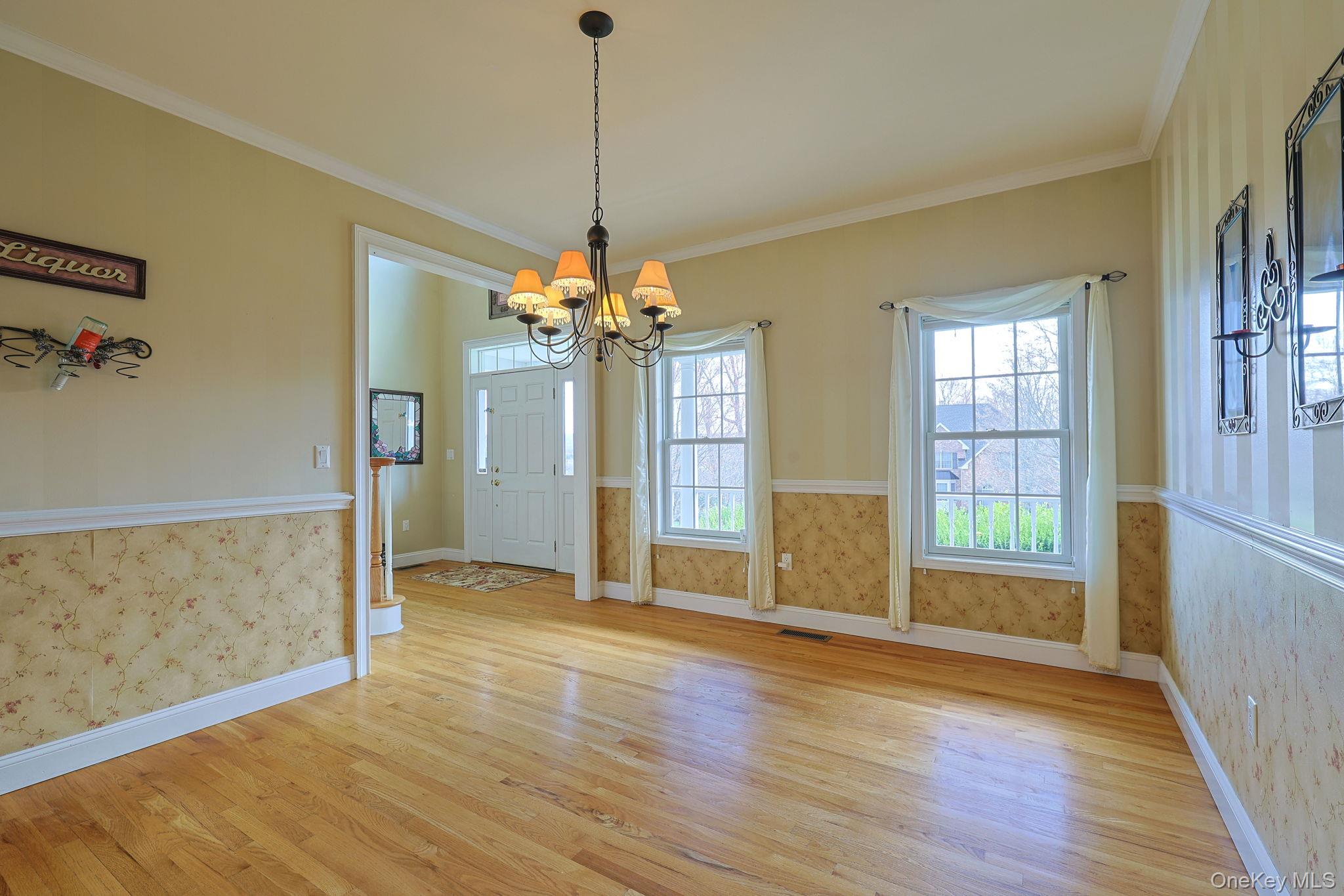99 Country Club Road Hopewell Junction, NY 12533 - Photo 12 of 44 a view of an empty room with wooden floor and a window