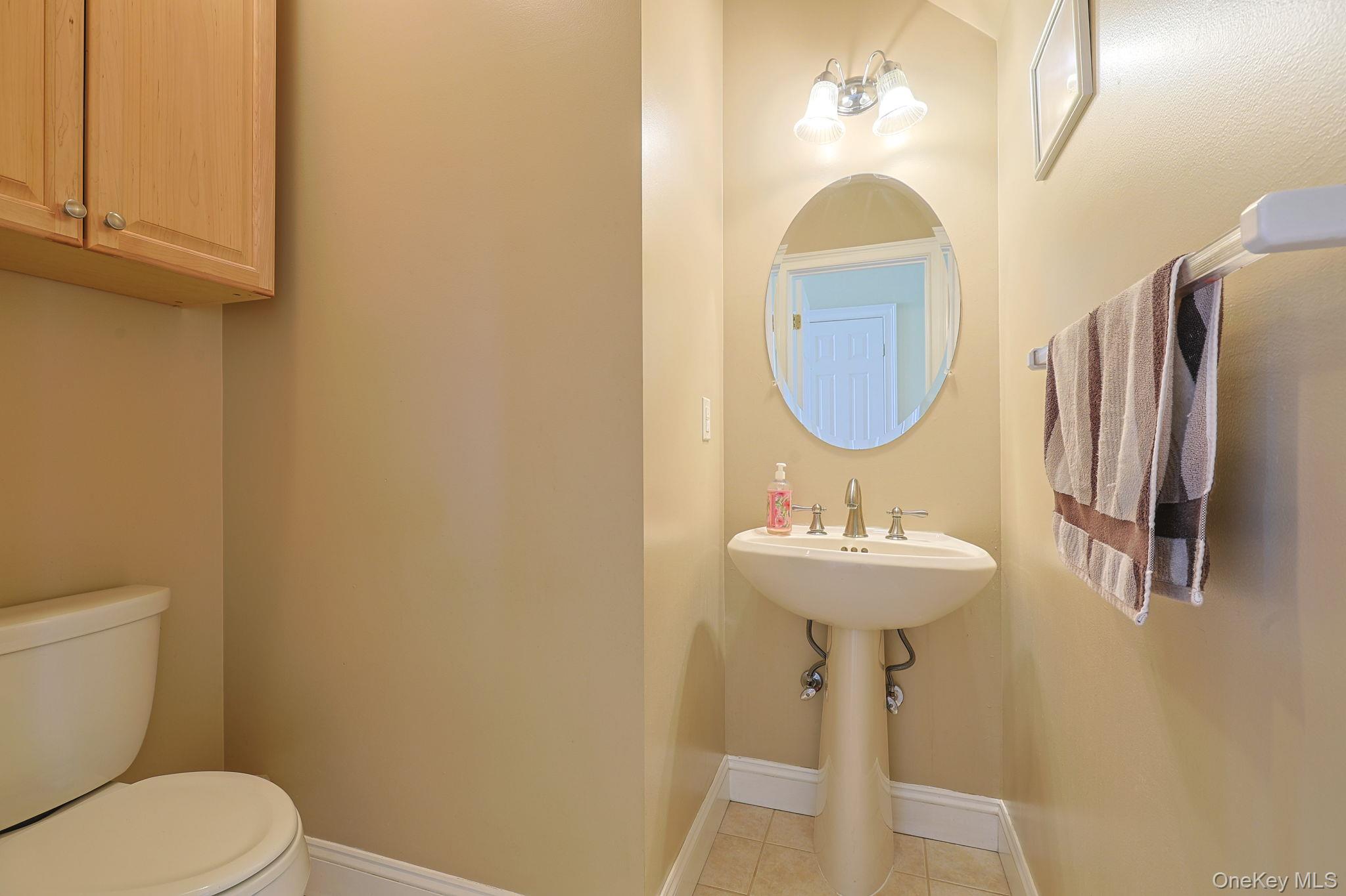 99 Country Club Road Hopewell Junction, NY 12533 - Photo 15 of 44 a bathroom with a sink toilet and a mirror