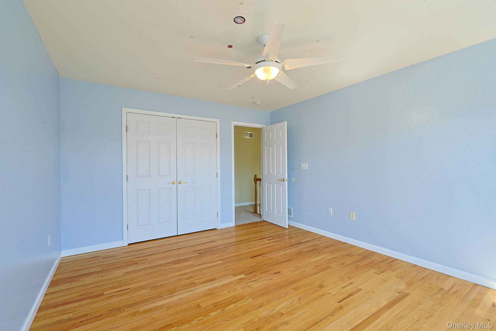 99 Country Club Road Hopewell Junction, NY 12533 - Photo 22 of 44 a view of empty room with wooden floor