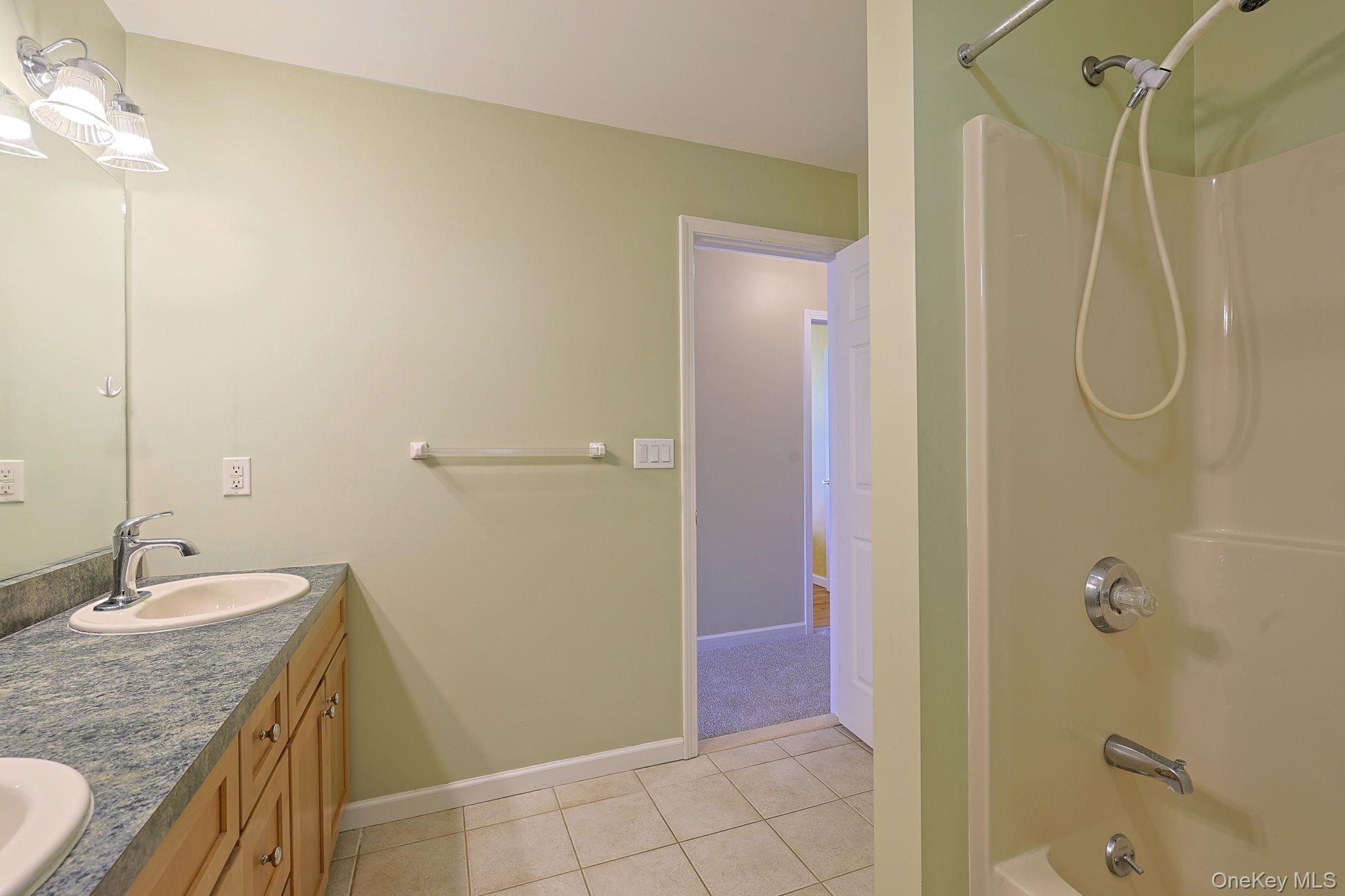 99 Country Club Road Hopewell Junction, NY 12533 - Photo 30 of 44 a bathroom with a granite countertop shower sink and mirror