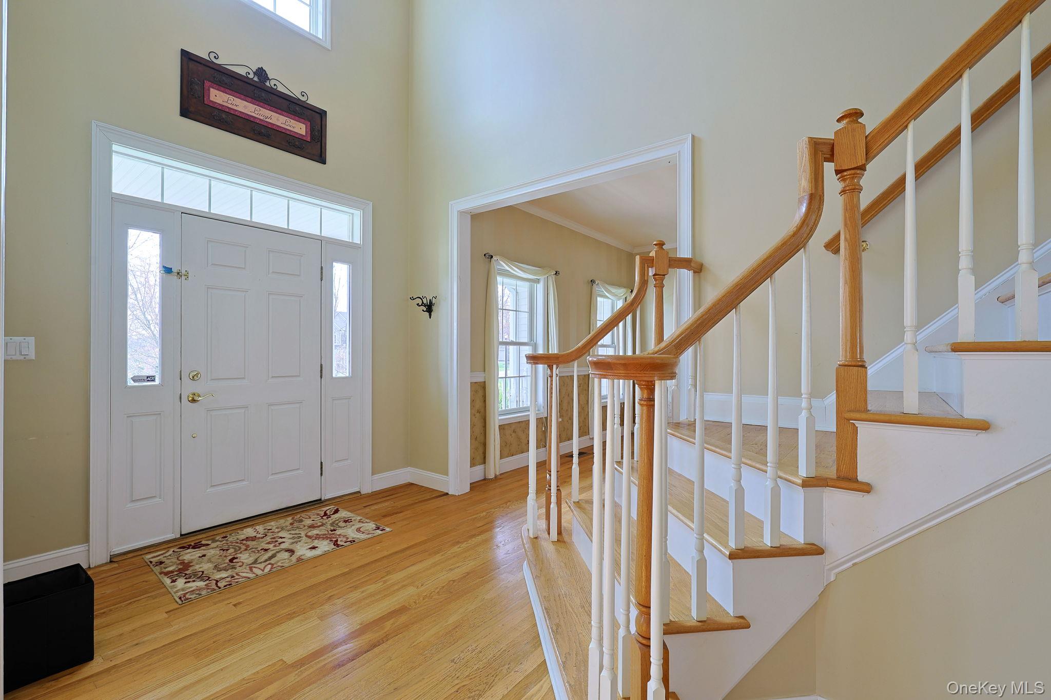 99 Country Club Road Hopewell Junction, NY 12533 - Photo 3 of 44 a view of front door with wooden floor and stairs