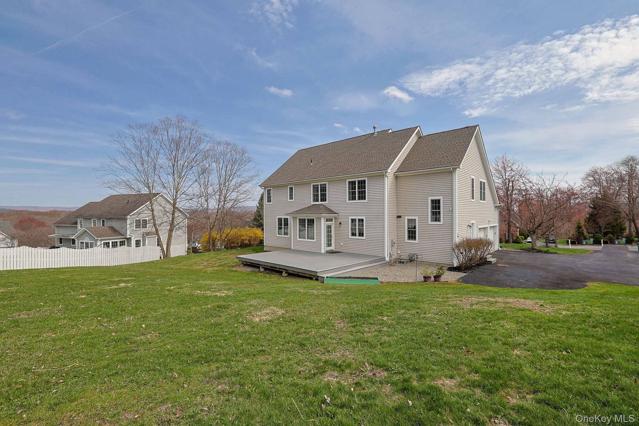 99 Country Club Road Hopewell Junction, NY 12533 - Photo 33 of 44 a view of a house with a big yard and a large tree