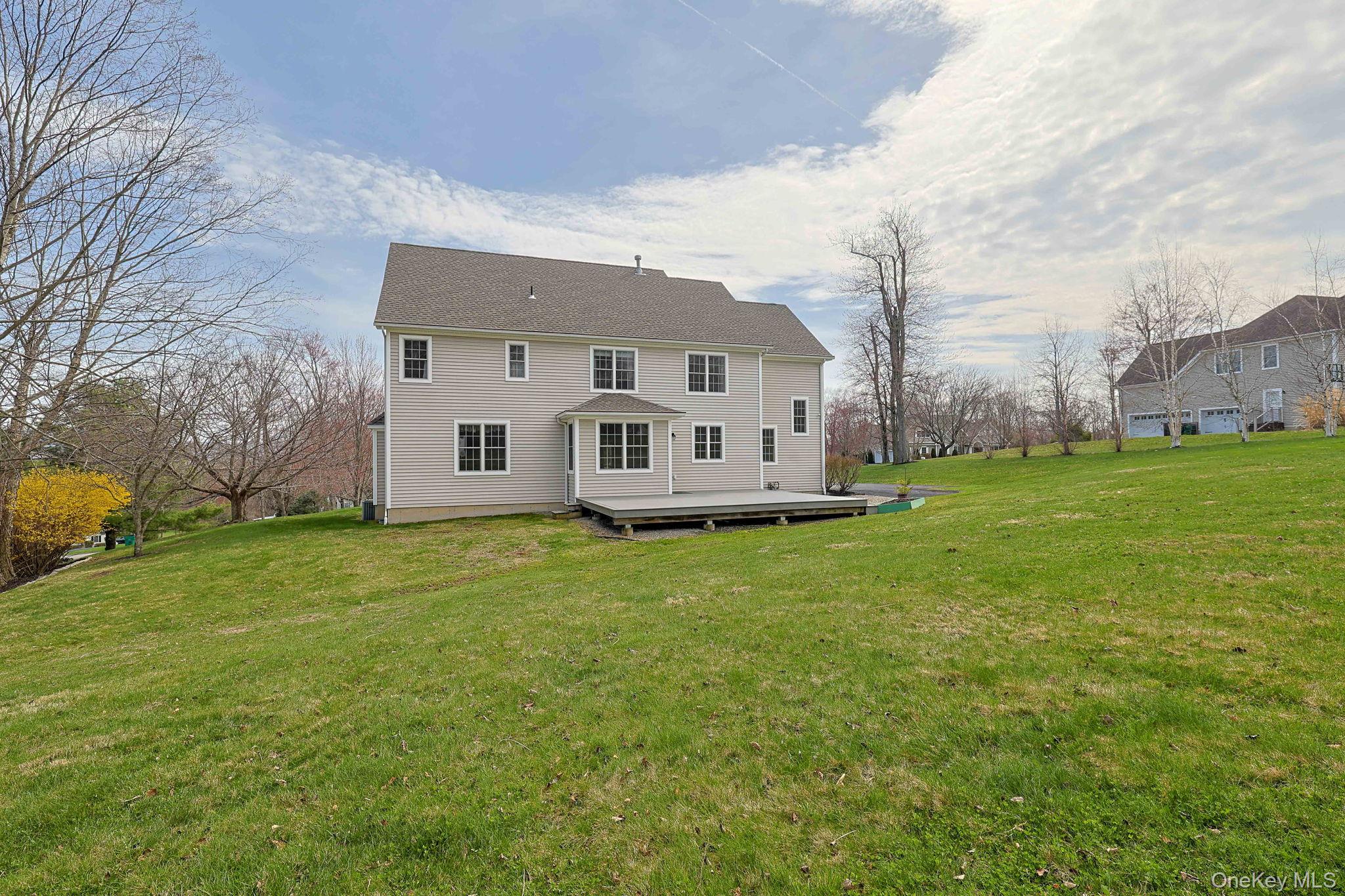 99 Country Club Road Hopewell Junction, NY 12533 - Photo 35 of 44 a view of a house with a big yard plants and large trees