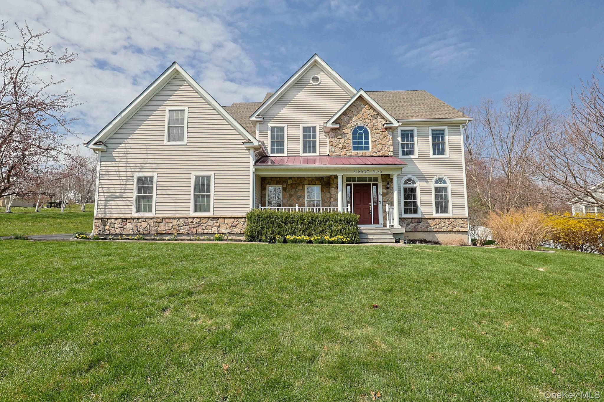 99 Country Club Road Hopewell Junction, NY 12533 - Photo 42 of 44 a front view of a house with a garden