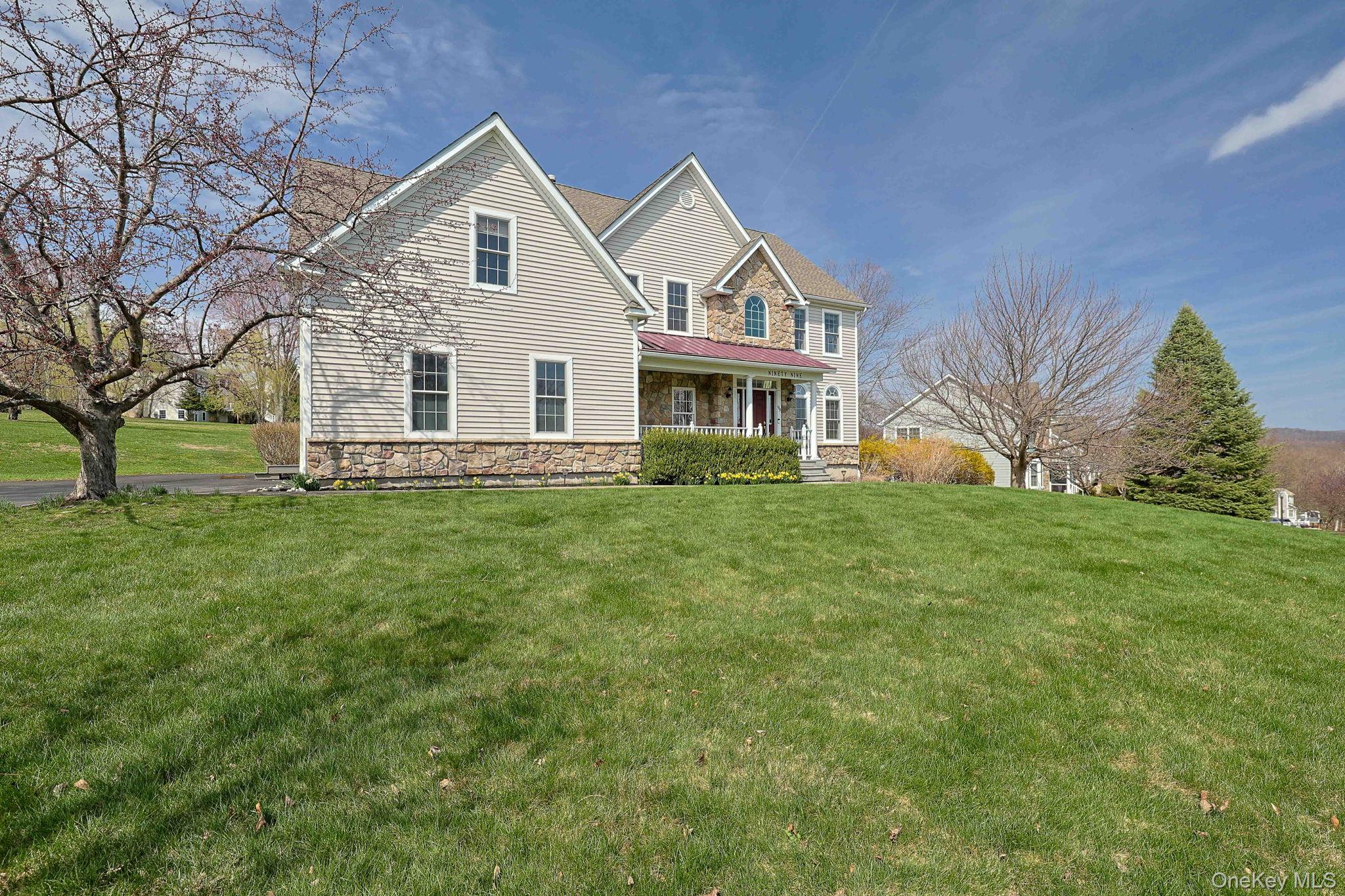 99 Country Club Road Hopewell Junction, NY 12533 - Photo 43 of 44 a front view of house with yard and green space