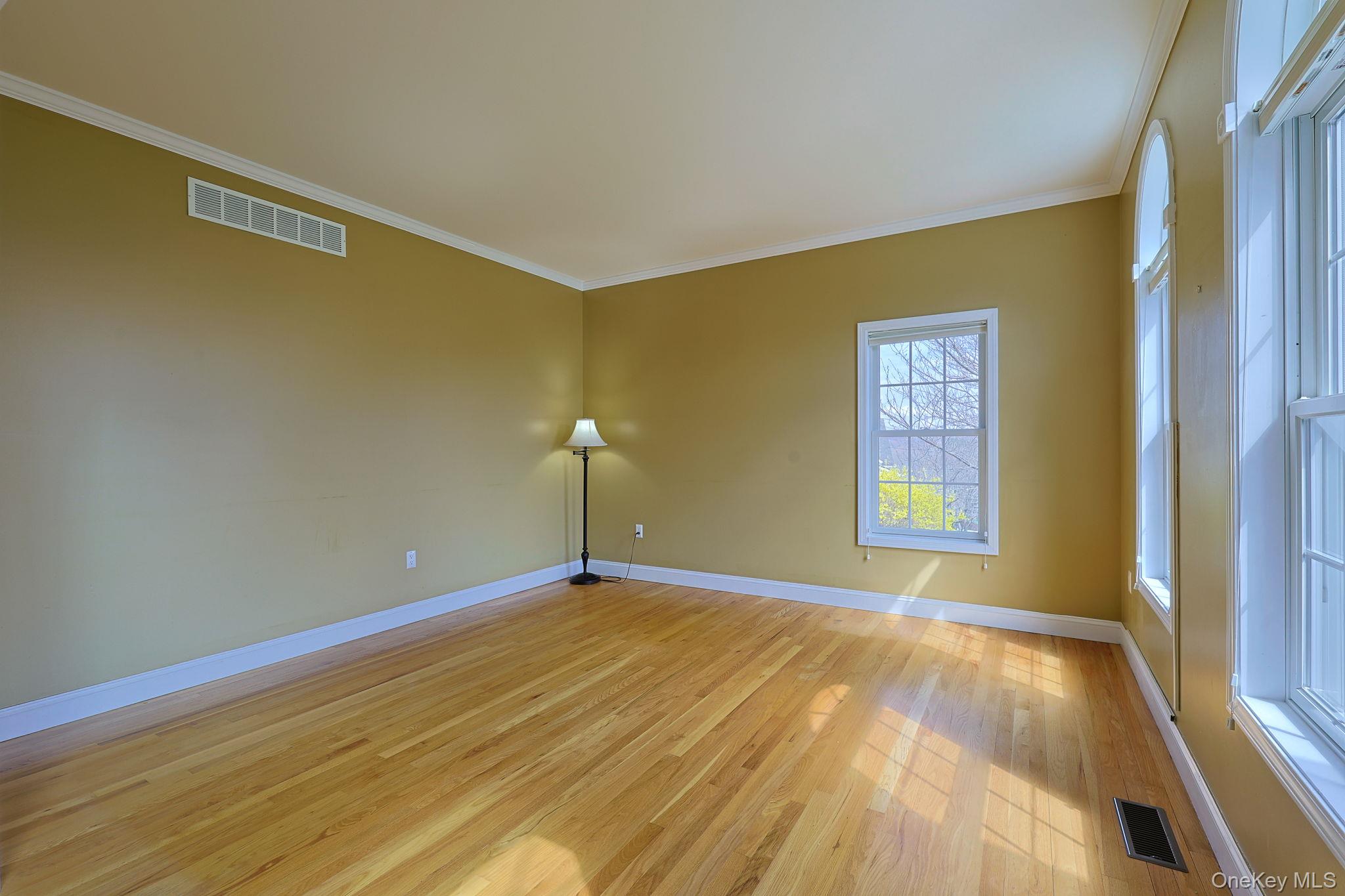 99 Country Club Road Hopewell Junction, NY 12533 - Photo 5 of 44 a view of an empty room with window and wooden floor