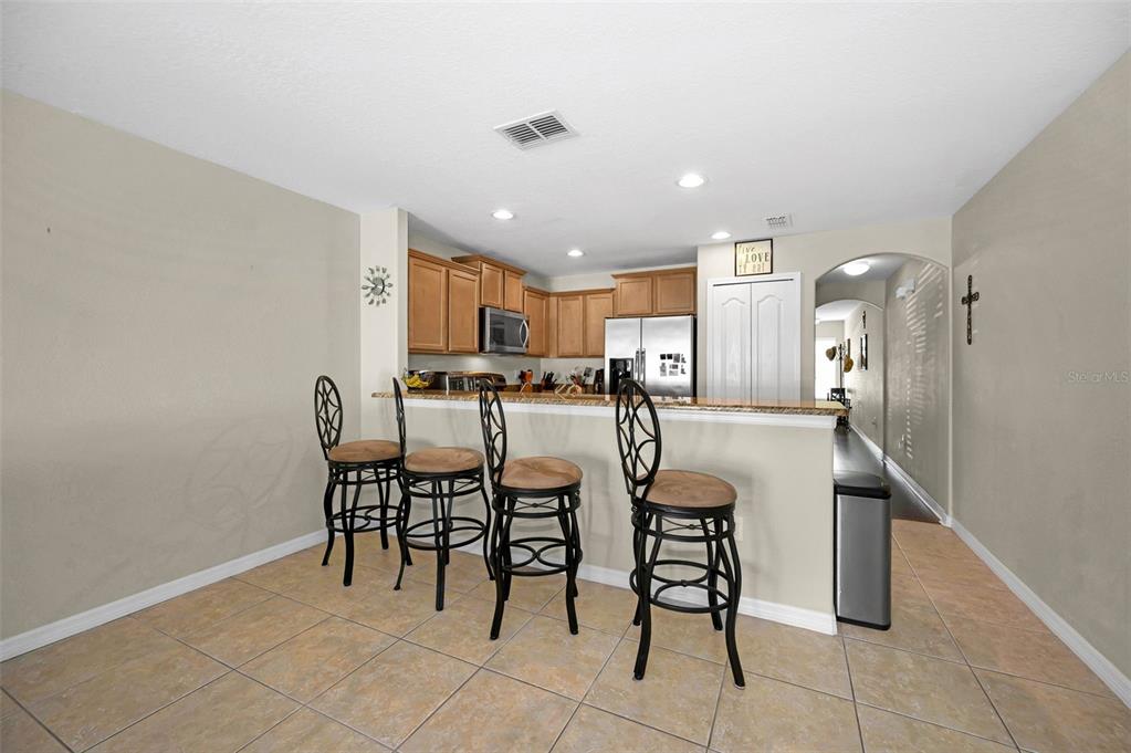 9736 Trumpet Vine Loop Trinity, FL 34655 - Photo 17 of 35 a view of a dining room with furniture