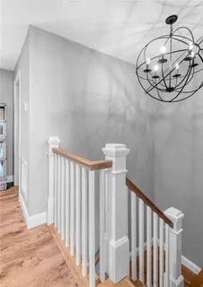 a bedroom with a bed and a large mirror