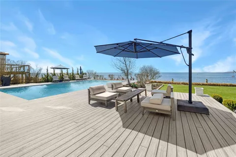 a view of a swimming pool with lounge chair