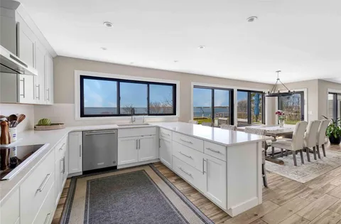a living room with furniture a fireplace and a table