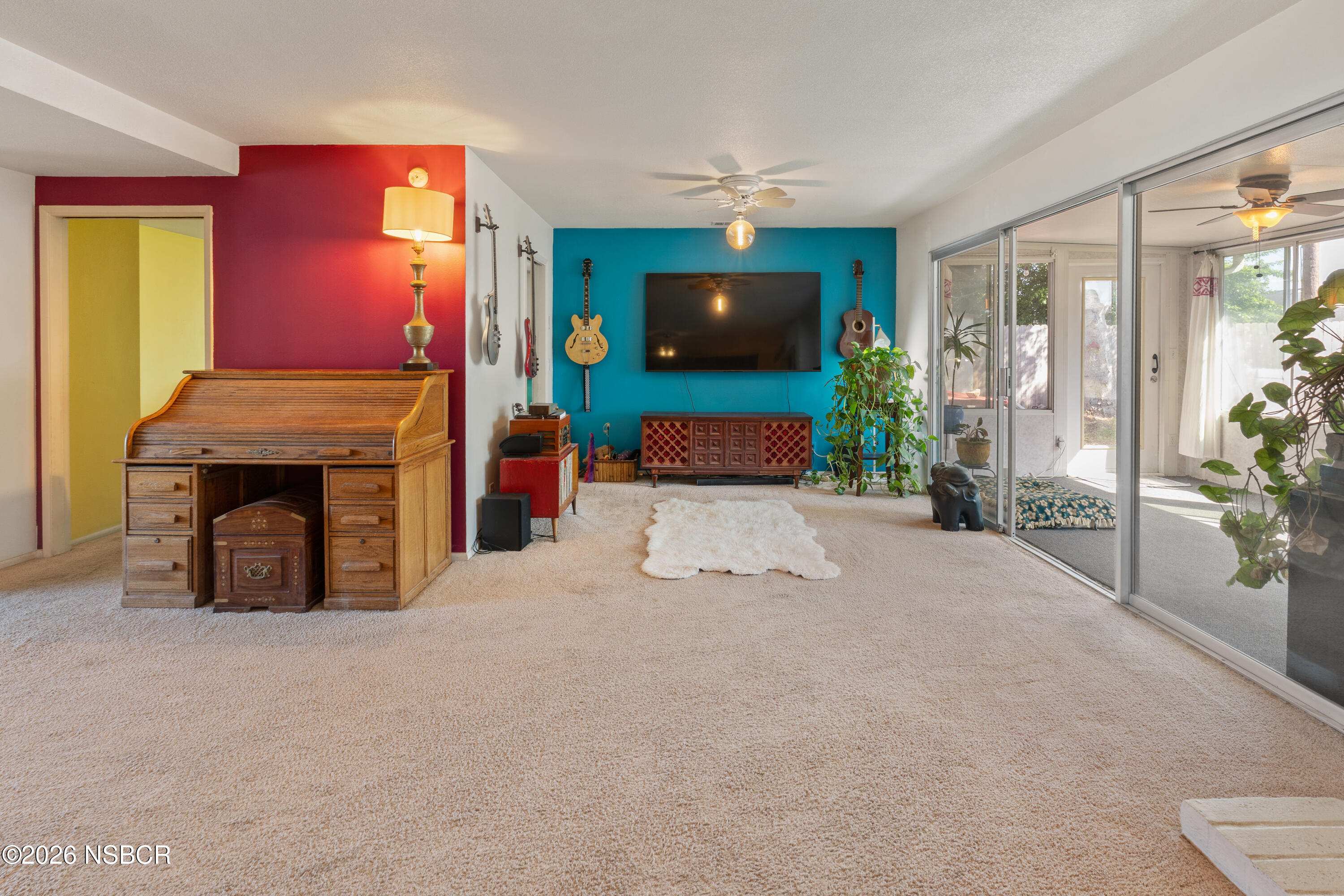 4220 Constellation Road Lompoc, CA 93436 - Photo 3 of 22 a living room with furniture a flat screen tv and a fireplace