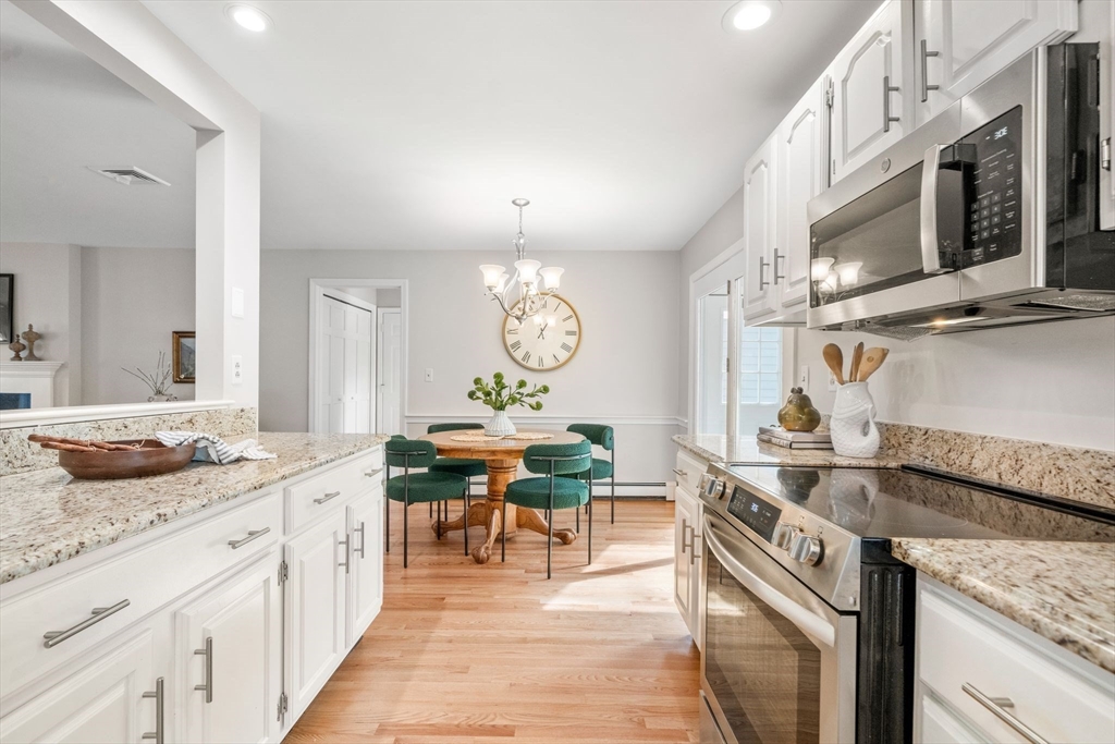 3 Eagle Drive North Reading, MA 01864 - Photo 11 of 42 a kitchen with stainless steel appliances granite countertop a sink and stove