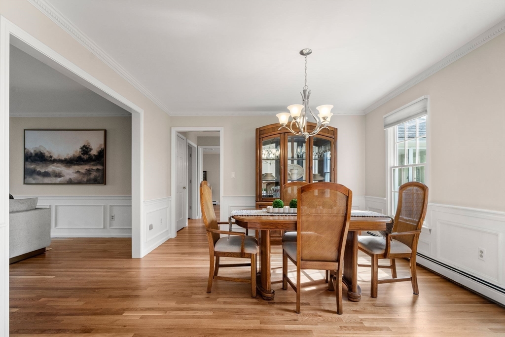 3 Eagle Drive North Reading, MA 01864 - Photo 16 of 42 a dining room with furniture a chandelier and wooden floor