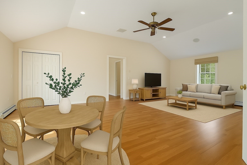 3 Eagle Drive North Reading, MA 01864 - Photo 19 of 42 a living room with furniture and a flat screen tv