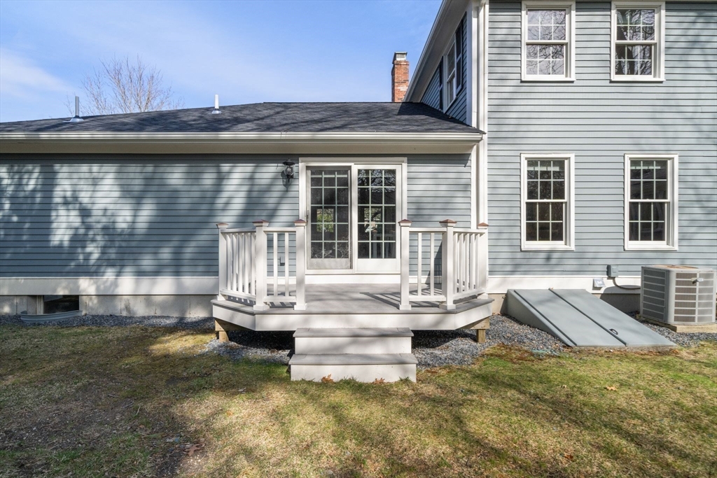 3 Eagle Drive North Reading, MA 01864 - Photo 27 of 42 a front view of a house with a garden and patio