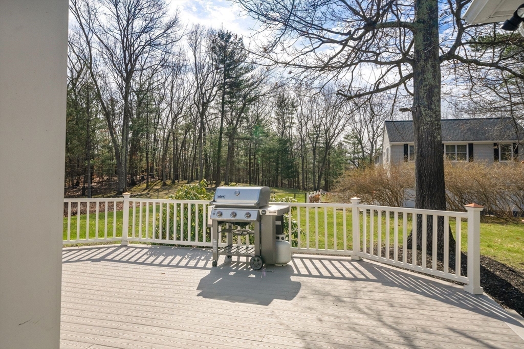 3 Eagle Drive North Reading, MA 01864 - Photo 39 of 42 a view of a wooden deck with a bench and white fence