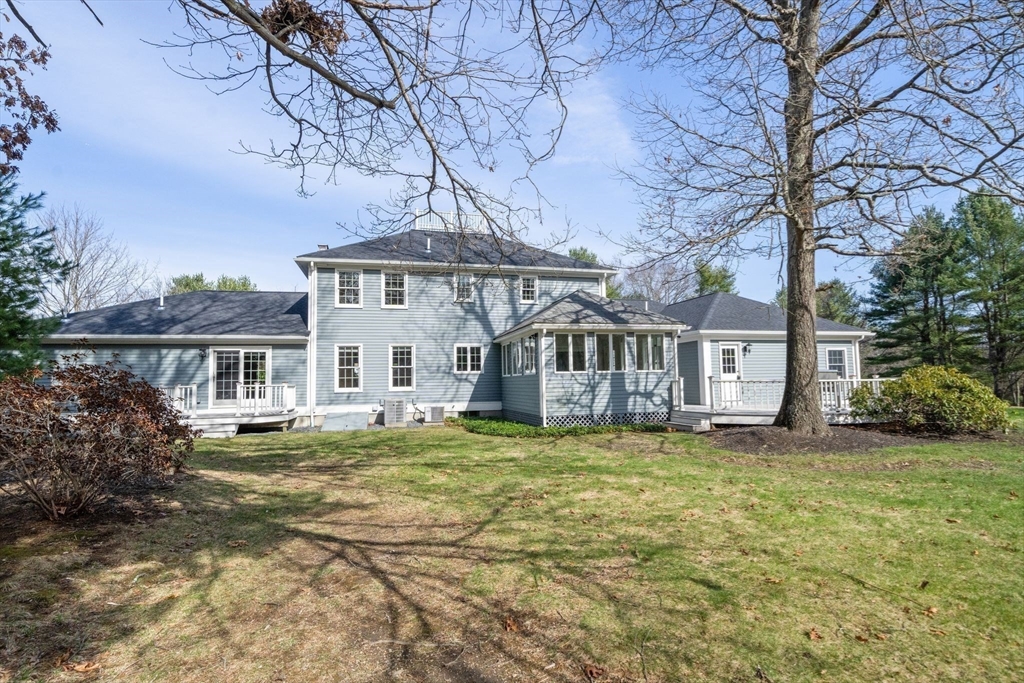 3 Eagle Drive North Reading, MA 01864 - Photo 4 of 42 a house that has a tree in front of it