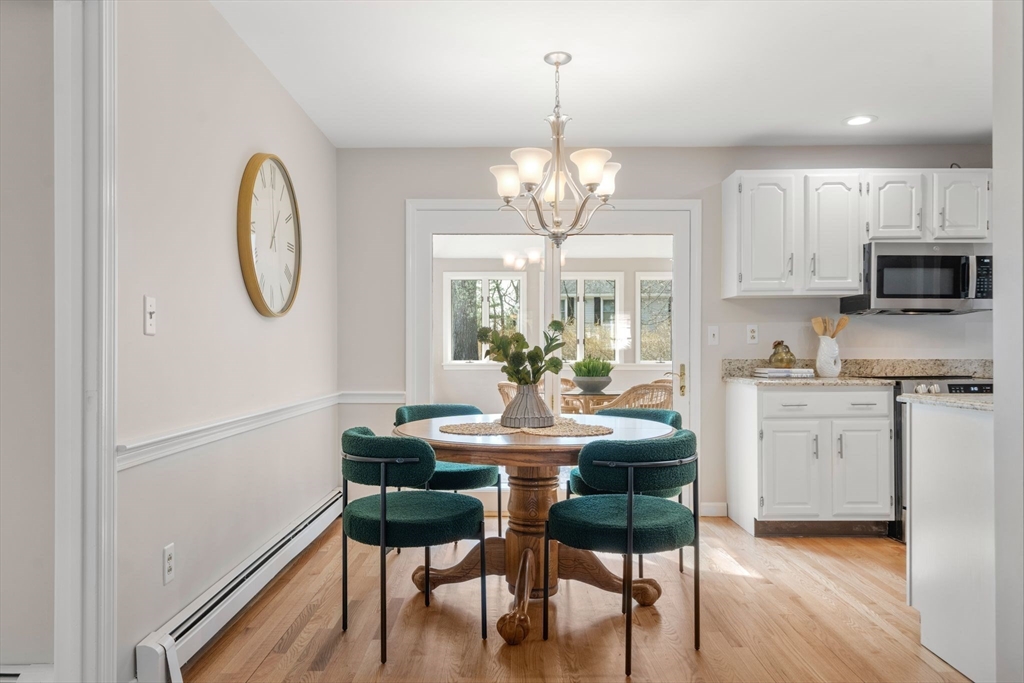 3 Eagle Drive North Reading, MA 01864 - Photo 10 of 42 a view of dining room and kitchen with wooden floor