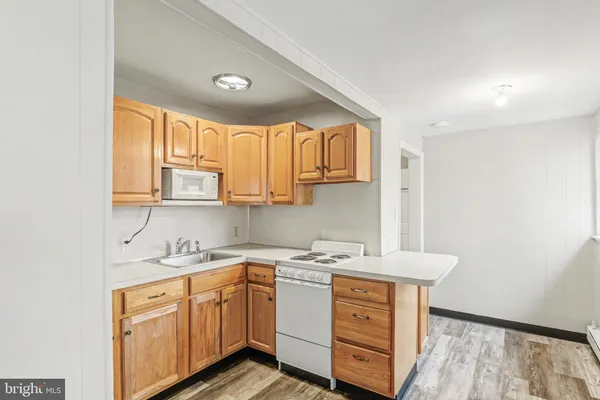 a utility room with cabinets a washer and dryer