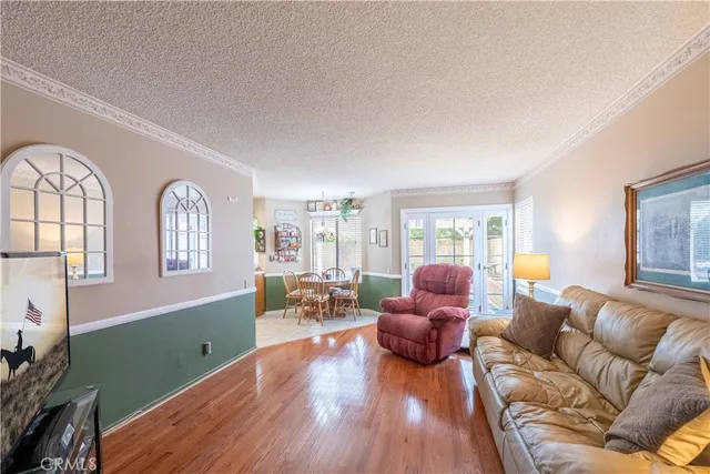 a kitchen with stainless steel appliances granite countertop a refrigerator a stove a sink and dishwasher