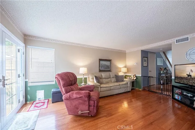 a kitchen with a stove a sink and a microwave