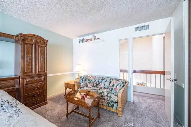 a bedroom with a bed and a table in it