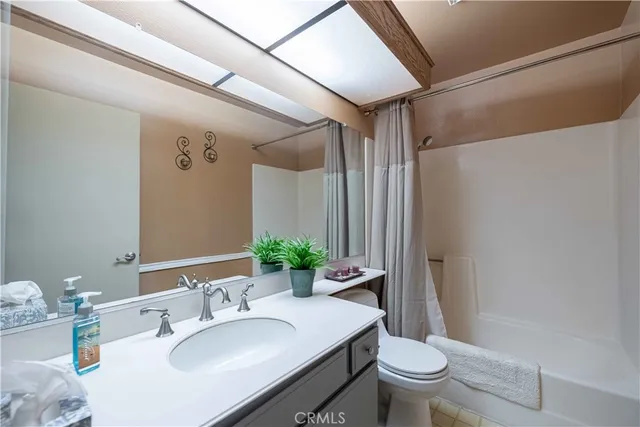 a front view of house with a garden