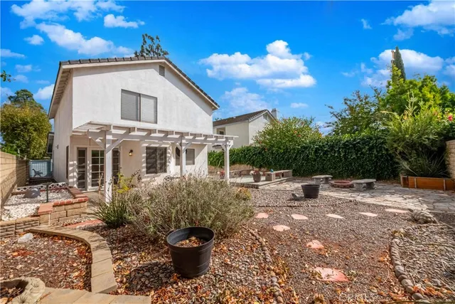 an aerial view of residential house with outdoor space and street view