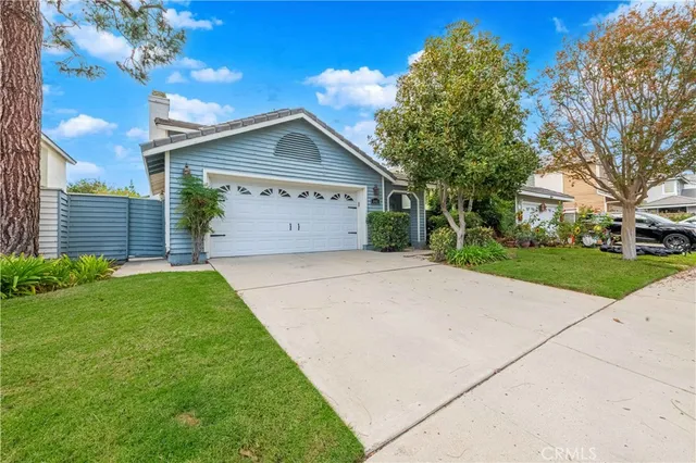 a view of a pathway of a house with potted plants