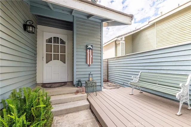 a living room with furniture a rug and a large window