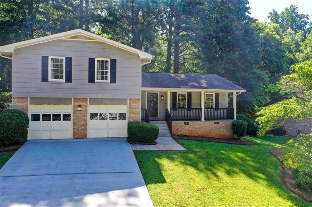 2332 Chevy Chase Lane Decatur, GA 30032 - Photo 1 of 1 a front view of house with yard and green space