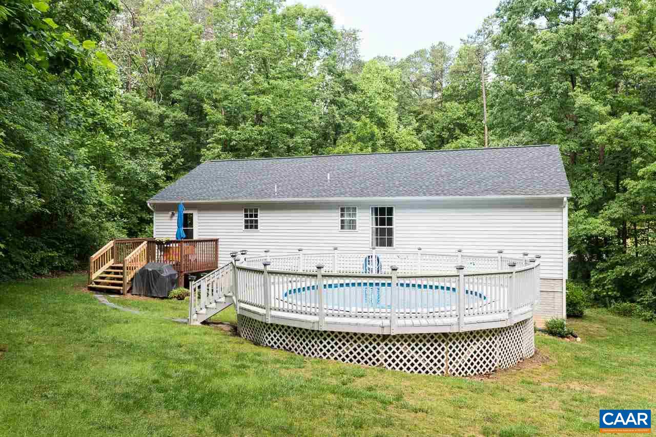 485 Carnation Road Ruckersville, VA 22968 - Photo 13 of 14 a view of a house with a tub and trees in the background