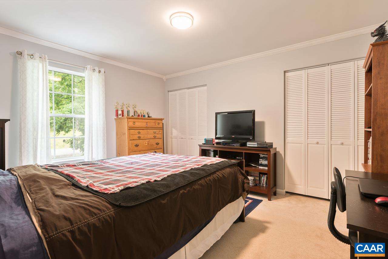 485 Carnation Road Ruckersville, VA 22968 - Photo 8 of 14 a bedroom with a bed and a television