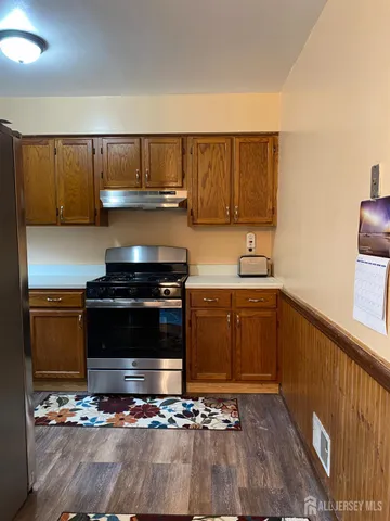 a kitchen with a sink and a stove top oven