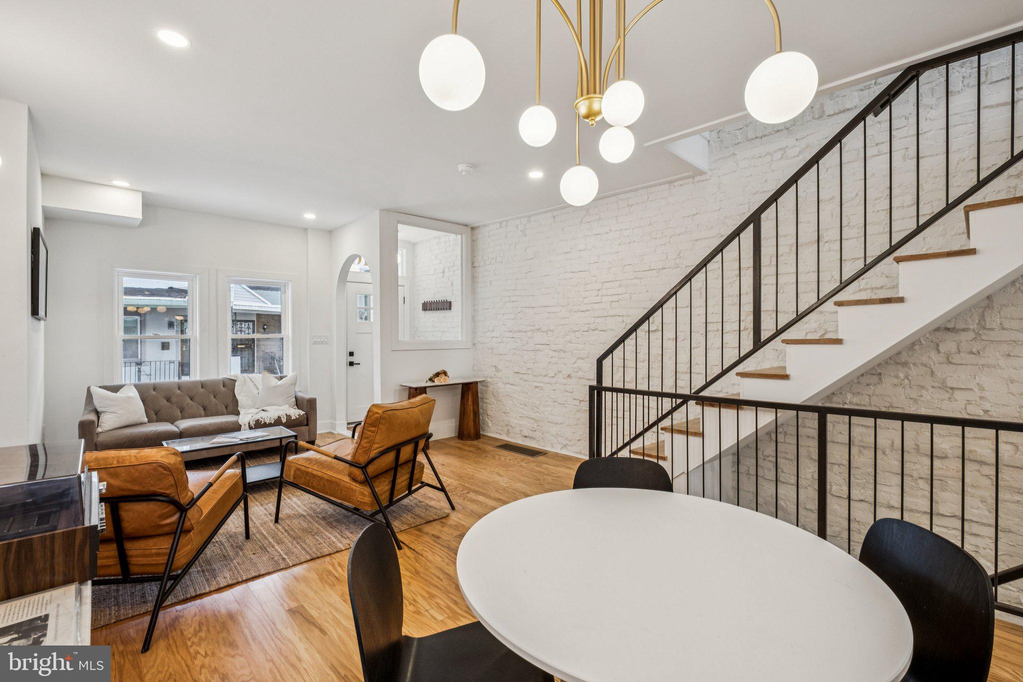 3010 Redner Street Philadelphia, PA 19121 - Photo 1 of 27 a view of a dining room with furniture and wooden floor