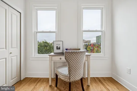 a view of a room with wooden floor and closet