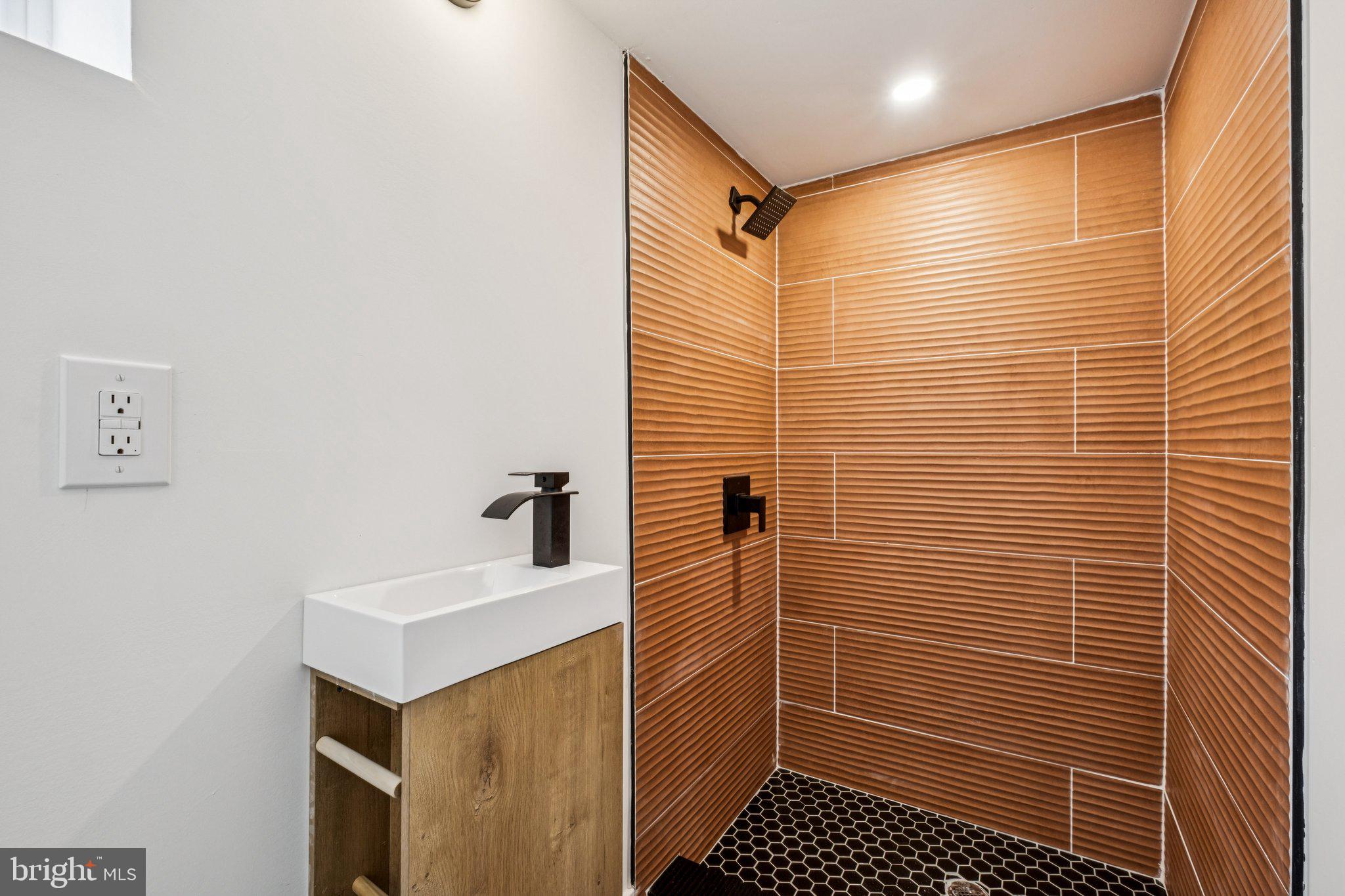 3010 Redner Street Philadelphia, PA 19121 - Photo 22 of 27 a bathroom with a sink toilet and shower