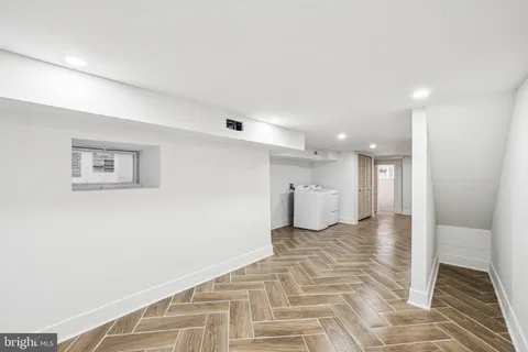 a view of a room with a white walls