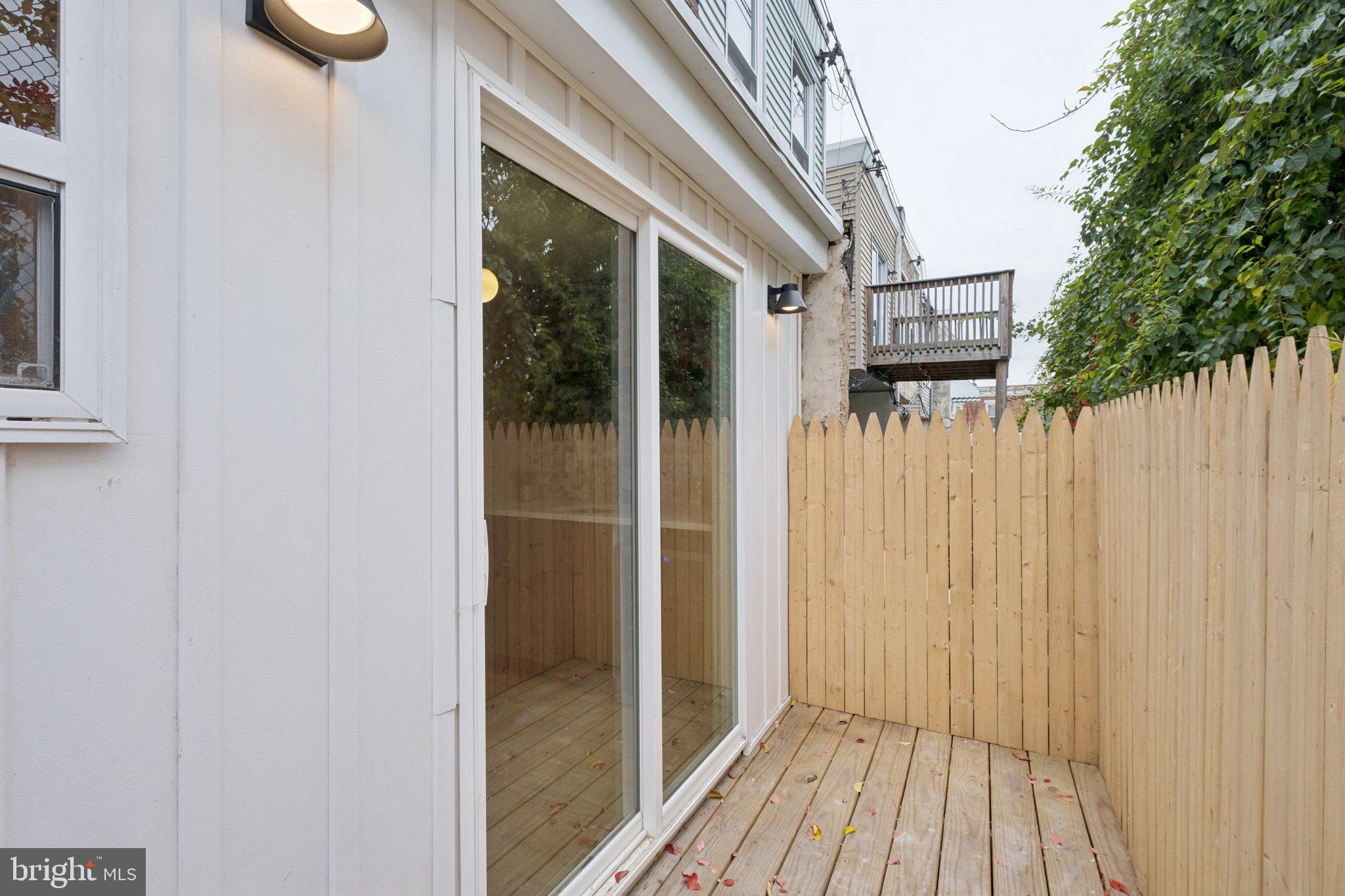 3010 Redner Street Philadelphia, PA 19121 - Photo 26 of 27 a view of a wooden door and a window
